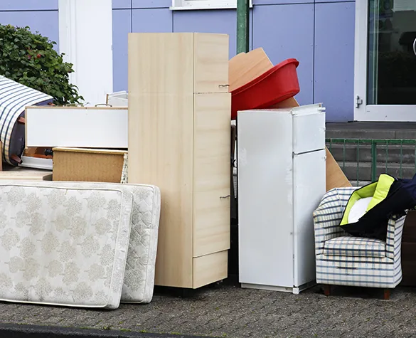 Stacked boxes and furniture awaiting junk removal, demonstrating the need for efficient residential junk removal services in Davie, FL.